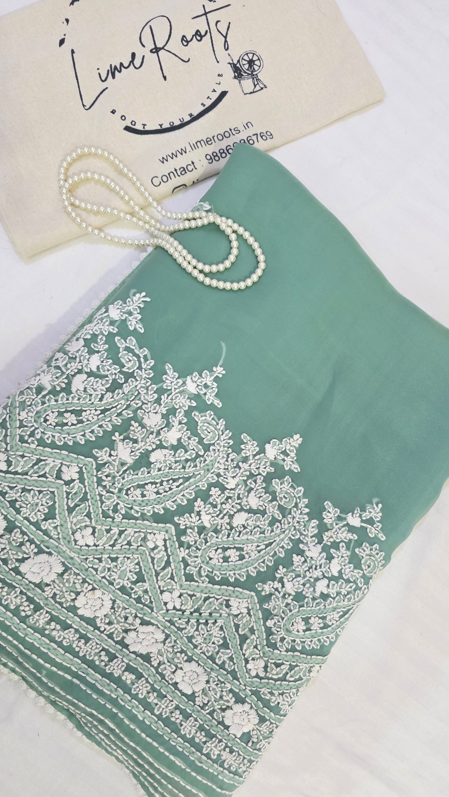 Green organza saree with Chikankari embroidery