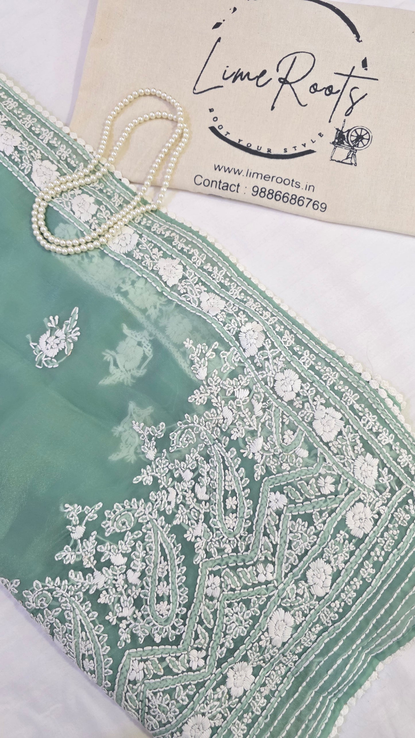 Green organza saree with Chikankari embroidery