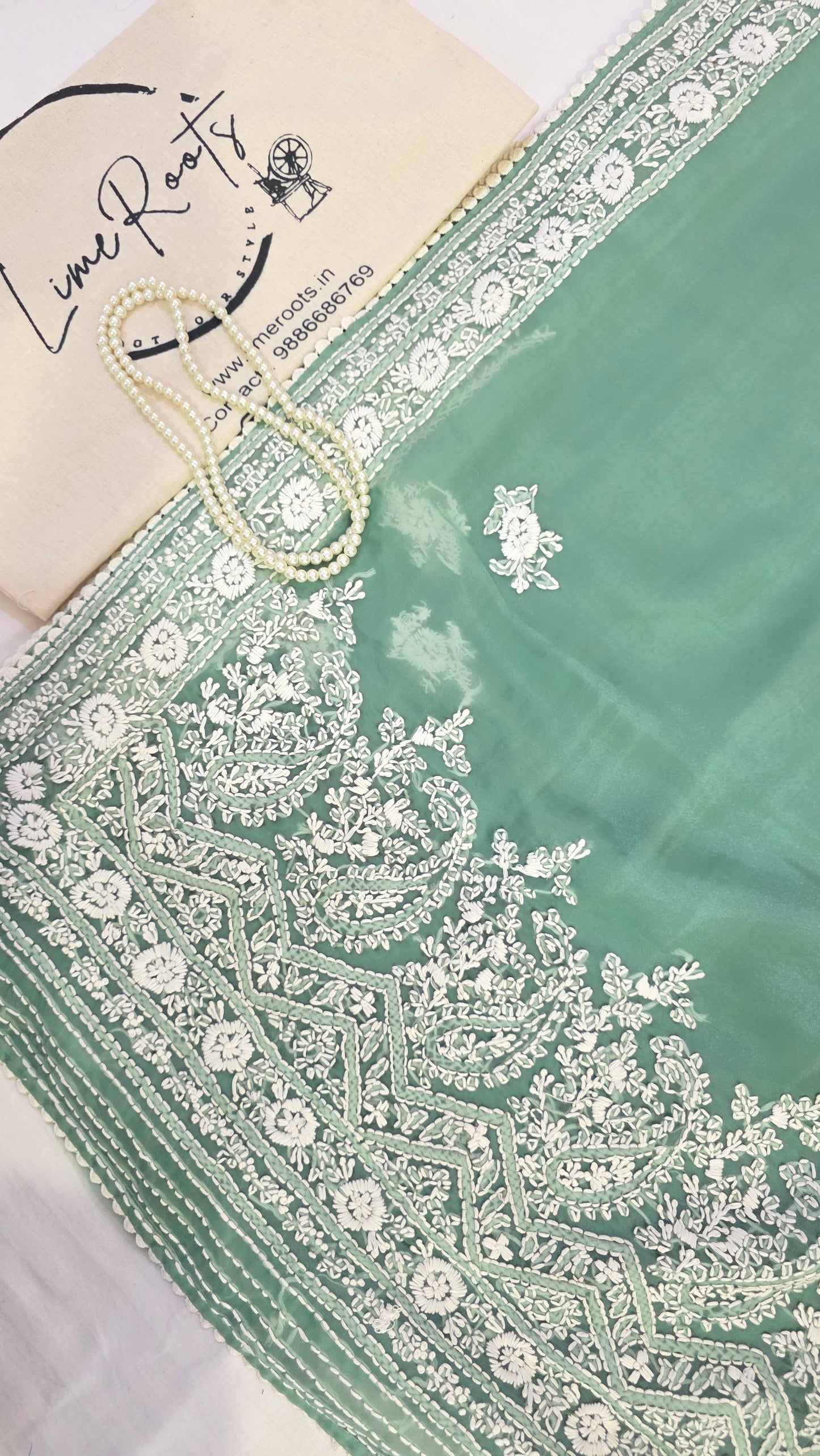 Green organza saree with Chikankari embroidery
