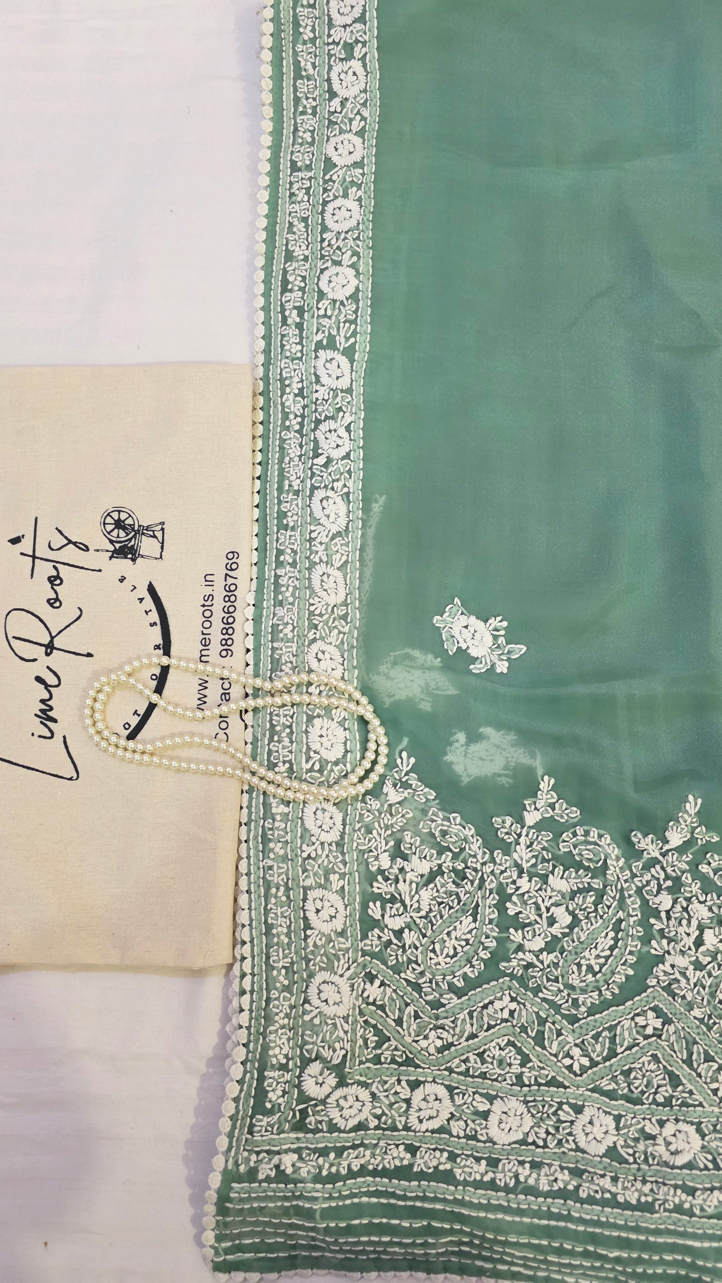 Green organza saree with Chikankari embroidery